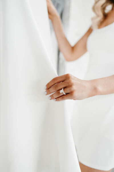 Bride holding dress planned by best wedding planners in chicago