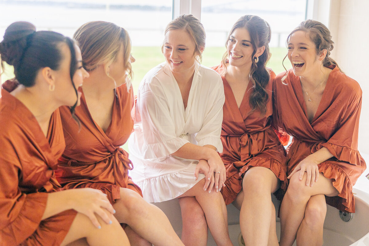 bride and bridesmaids getting ready in matching robes in Newport