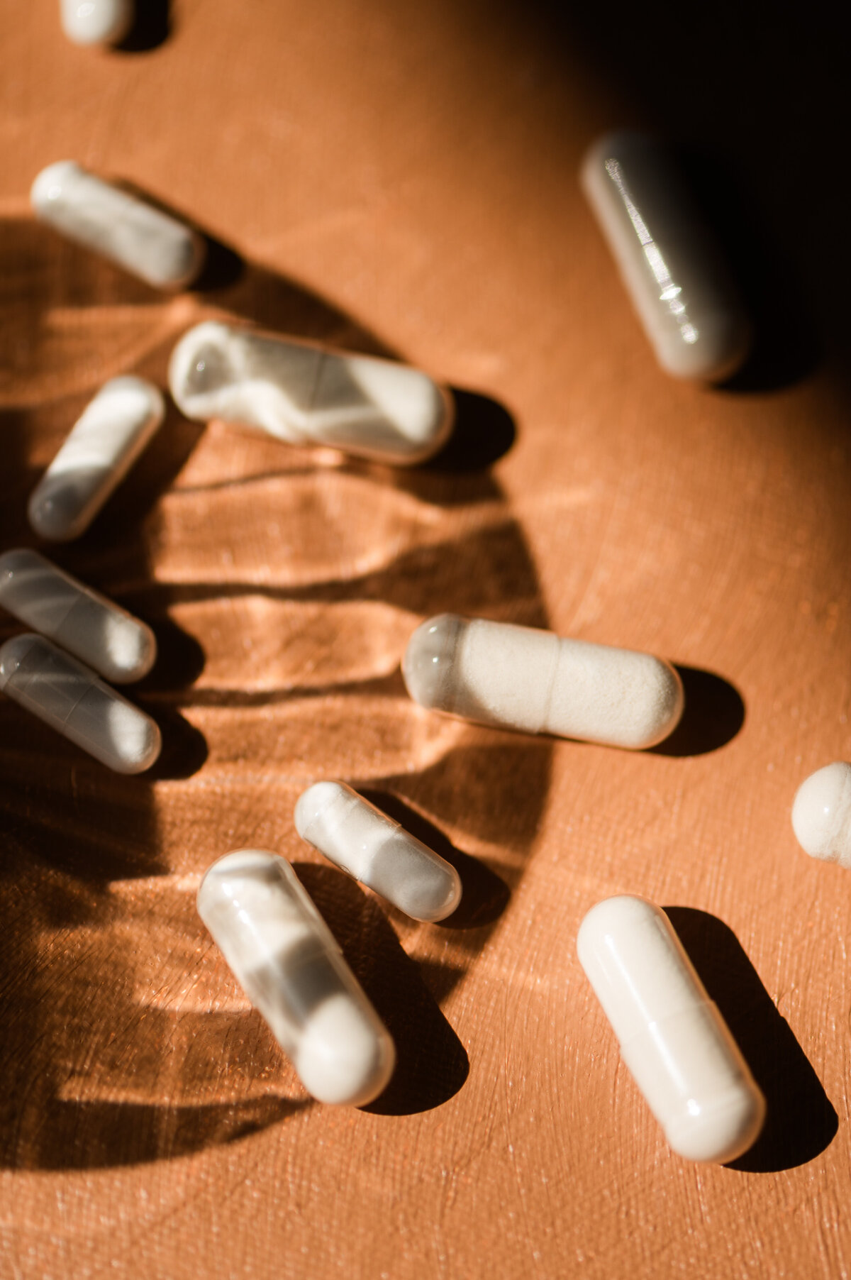 Supplement pills photographed in an artistic way reflecting the art and science of medicine for a holistic medical brand