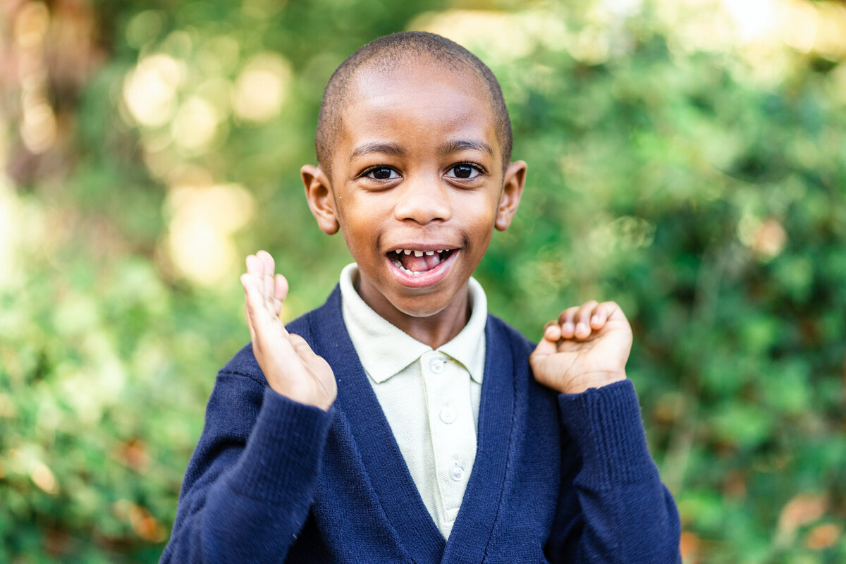 boy-smiling-in-navy-sweater