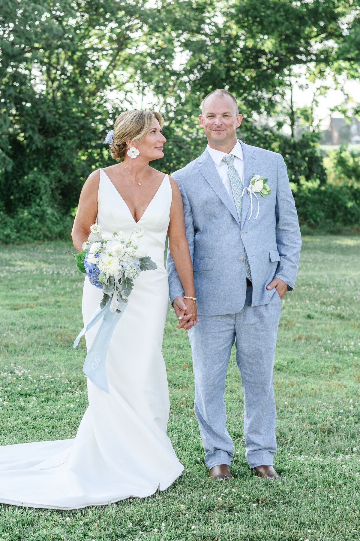 Couple from a blue & white themed spring wedding in Lancaster, Virginia