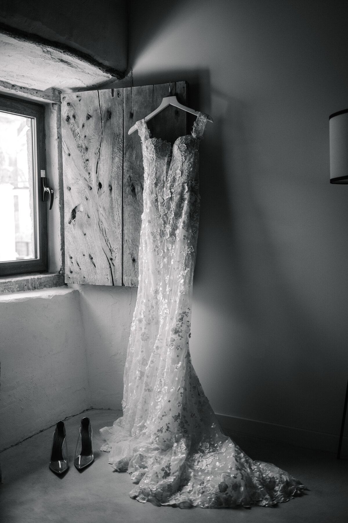 lee grebenau wedding dress hanging in bridal suite at destination wedding
