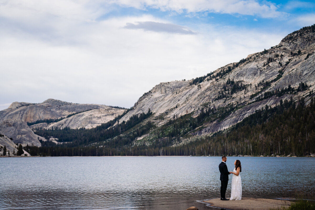 Stunning elopement photograph taken on a lake in the High Sierra's of Yosemite National Park