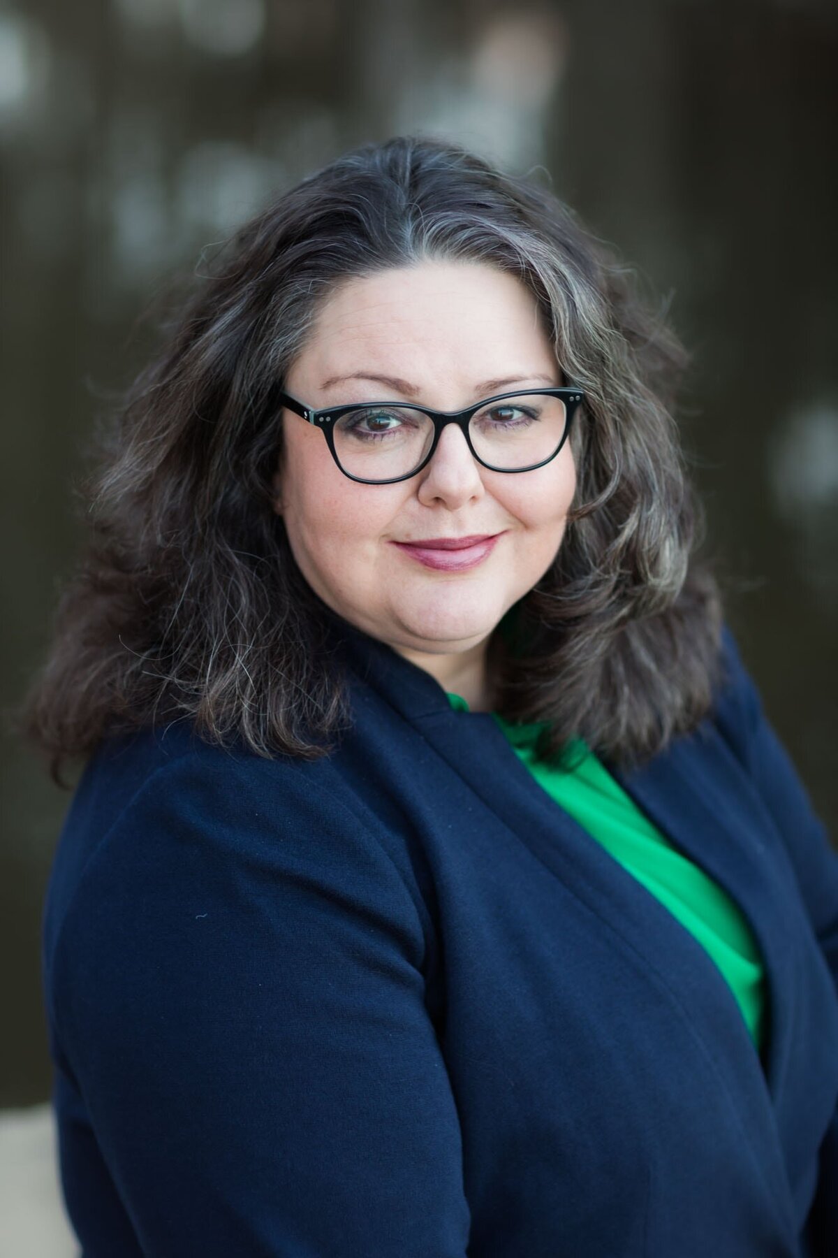 Headshot for this beautiful lady in blue and green