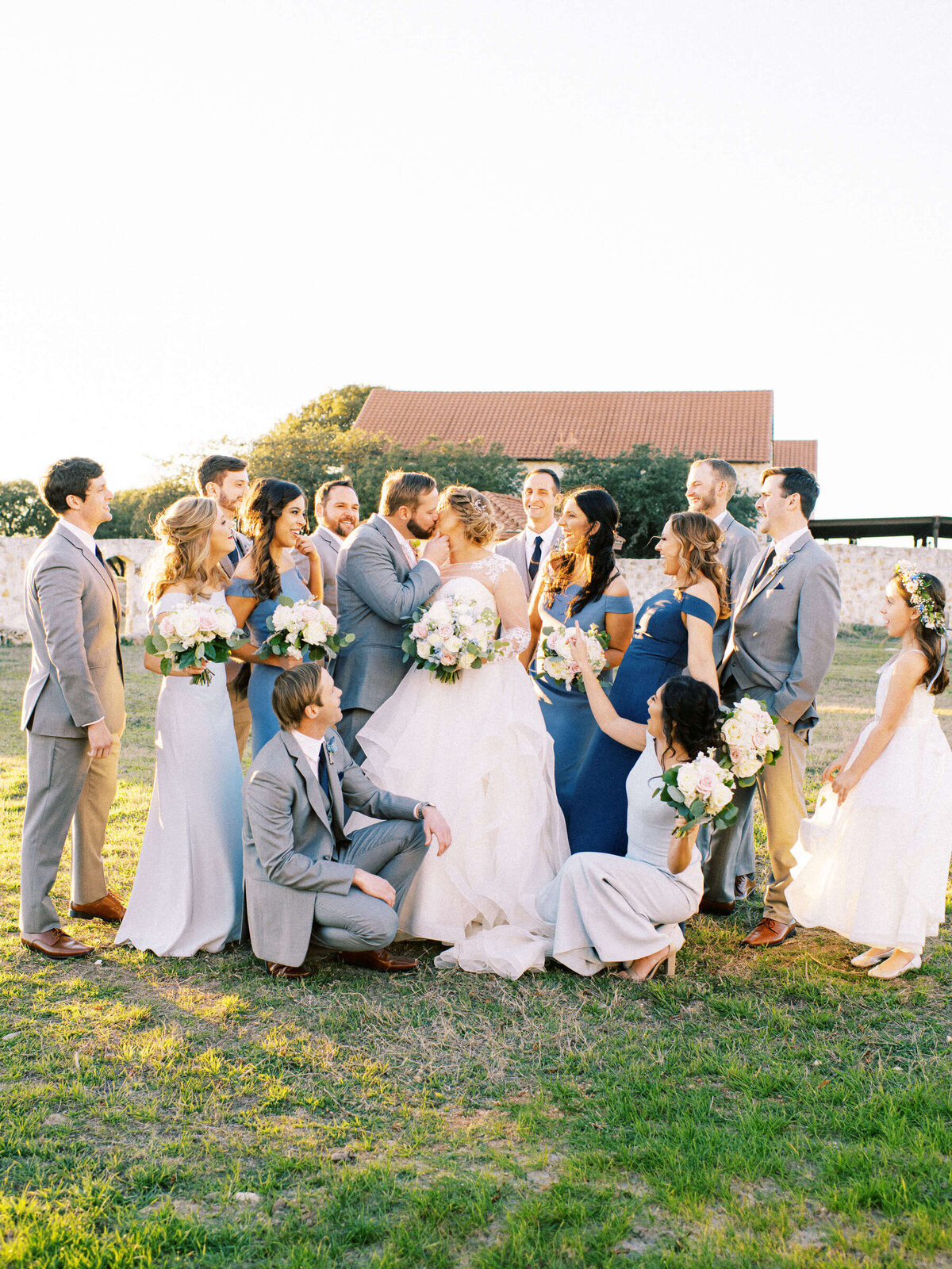 Wedding party celebrates with bride and groom at spring Texas wedding