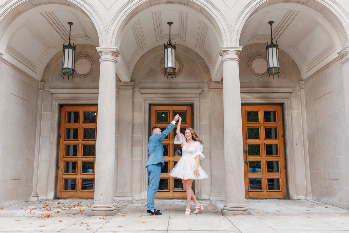 couple dancing at pillars at the frick museum