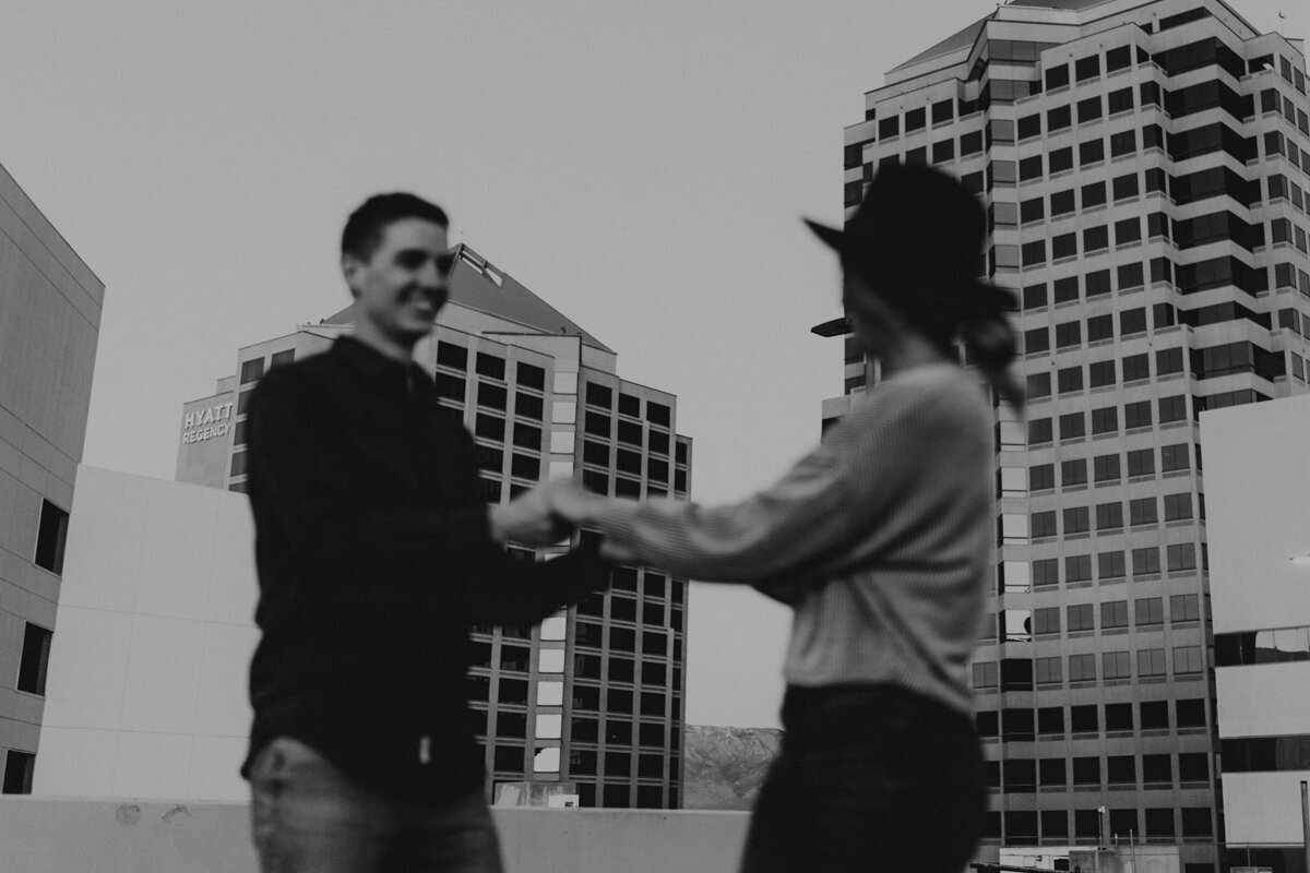 couple spinning on downtown rooftop