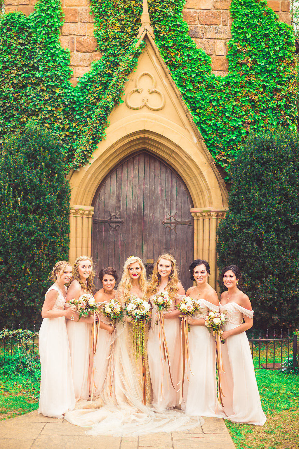Wedding Photograph Of Bride and Bridesmaid Holding Flower Bouquets Los Angeles