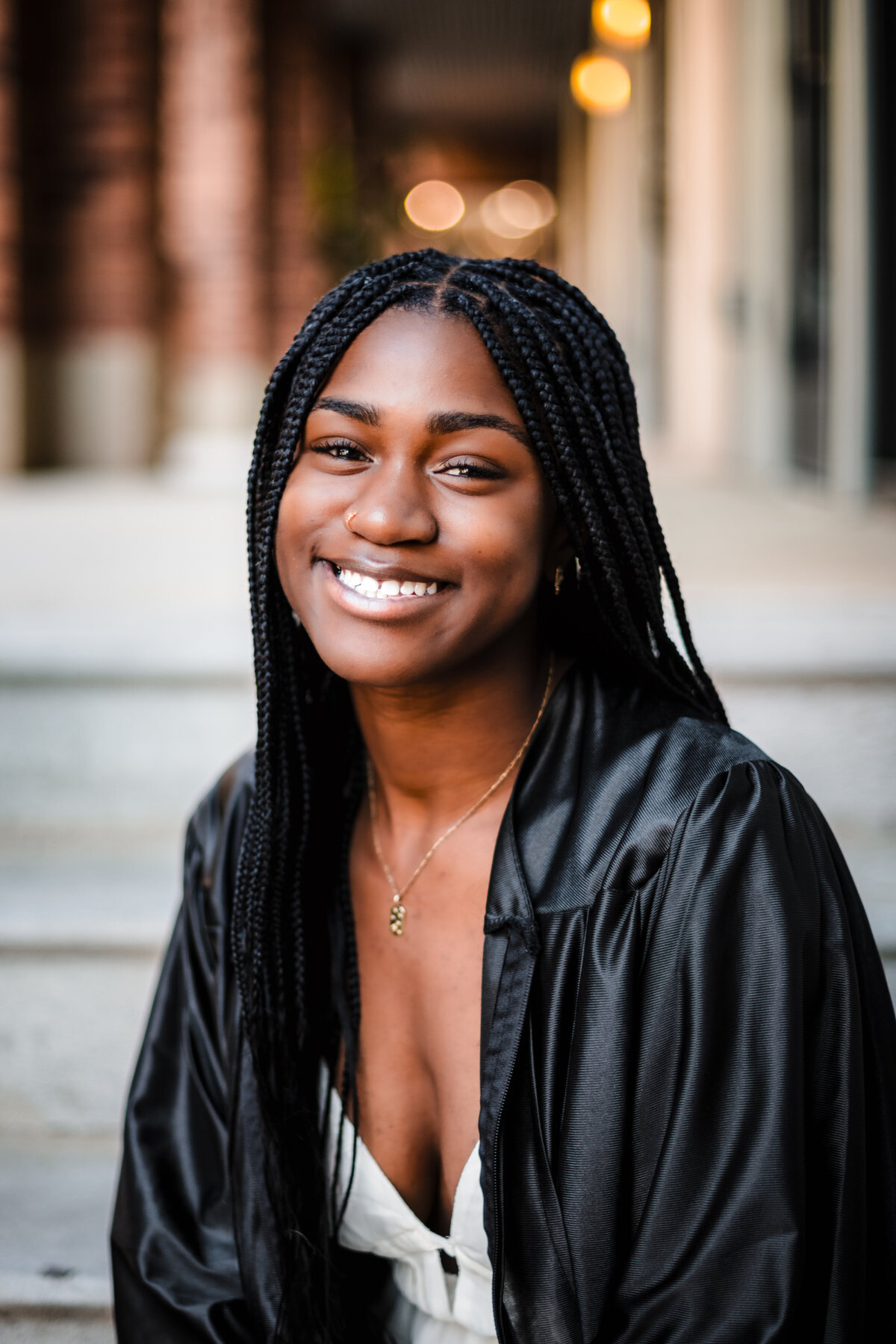 Close-up of Steel High School senior smiling confidently in black graduation gown