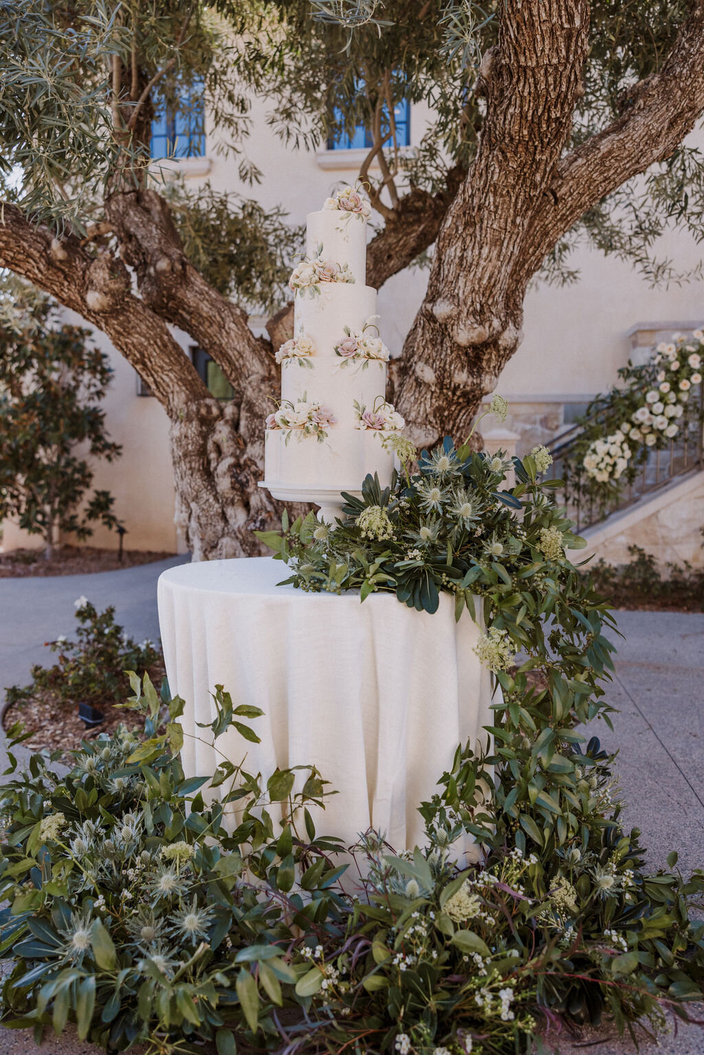 wedding cake with cascading florals at monserate winery tuscan villa