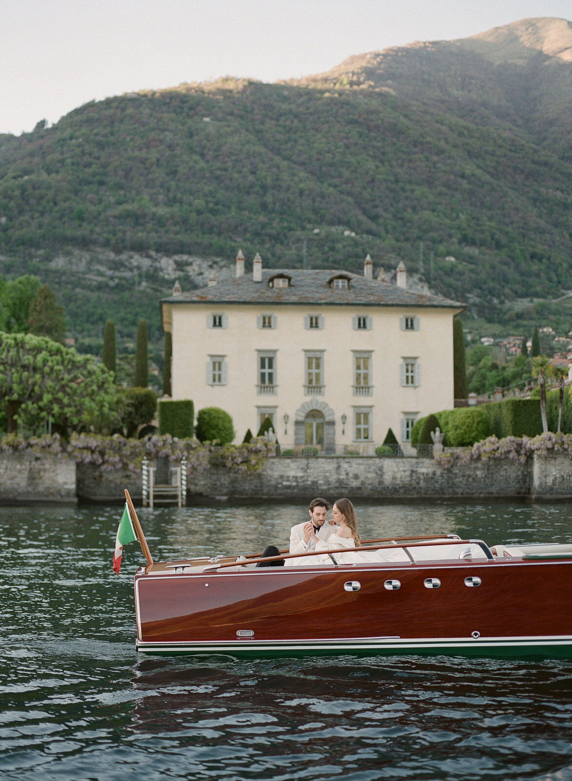 wedding couple boat ride on a wooden Cadenazzi in Lake Como