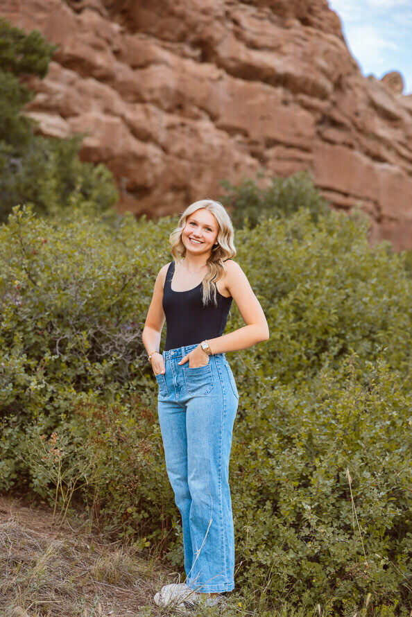 Girl poses with hands in pockets at South Valley Park in Littleton, Colorado.