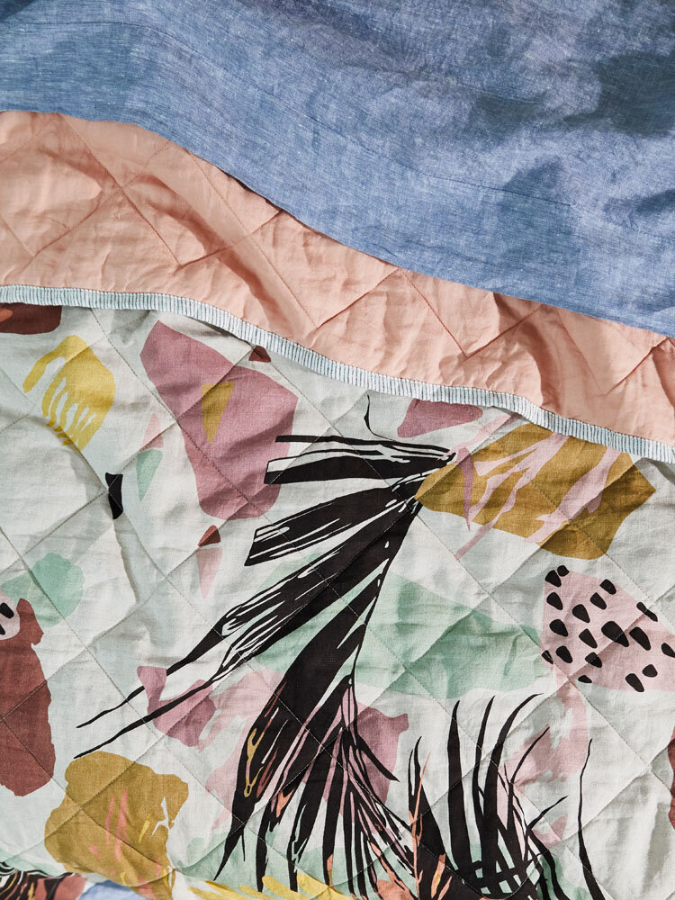 Colourful kitchen tablescape with fruits, patterned plates, and linen styling by Melbourne interior stylist for residential design interiors.