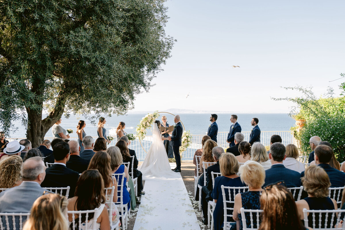 bride a groom exchanging vows on the terrace outdoor at villa silvana overlooking the sea