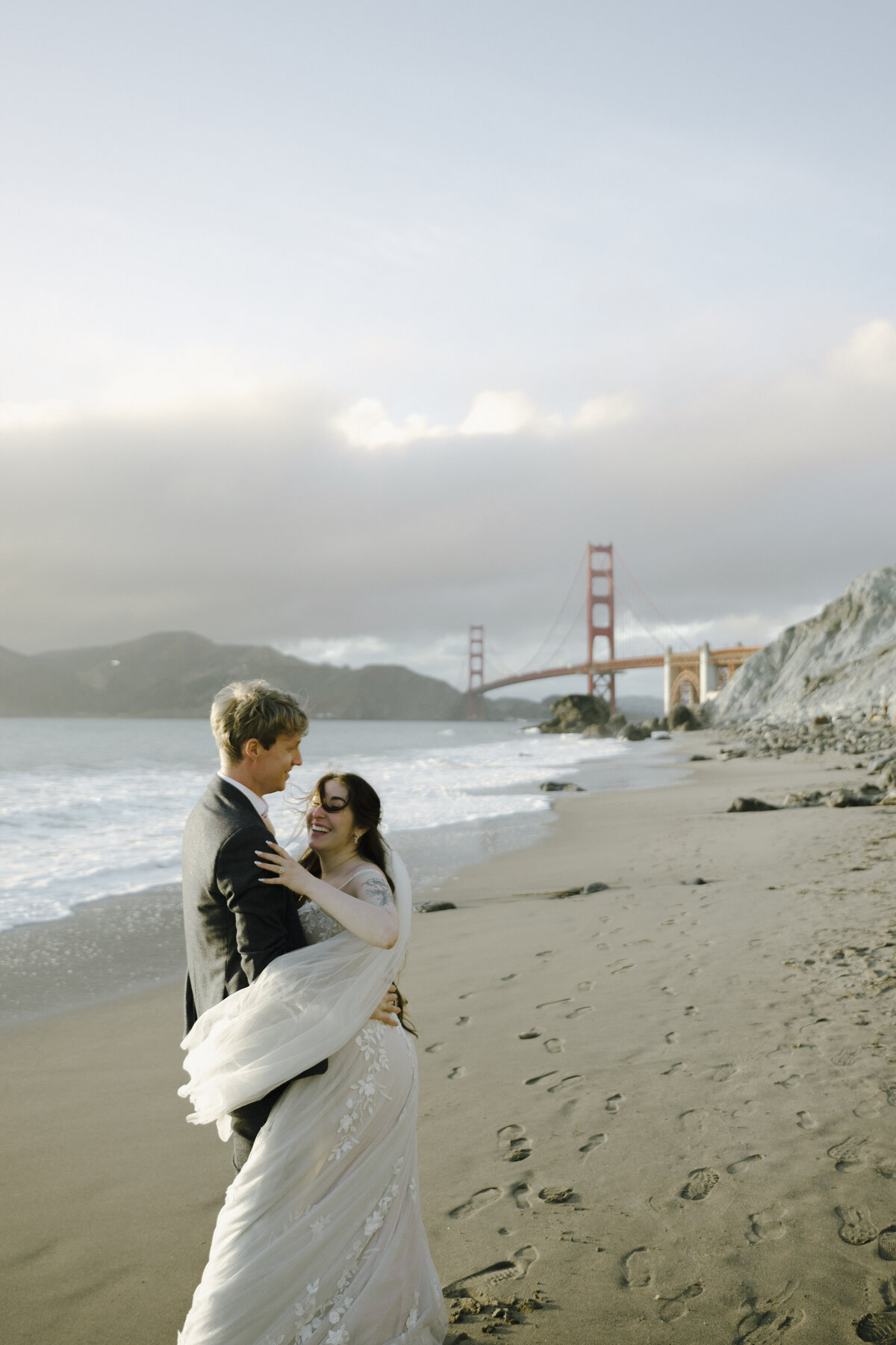 Bride and Groom at Marshall's Beach in San Francisco, California at sunset