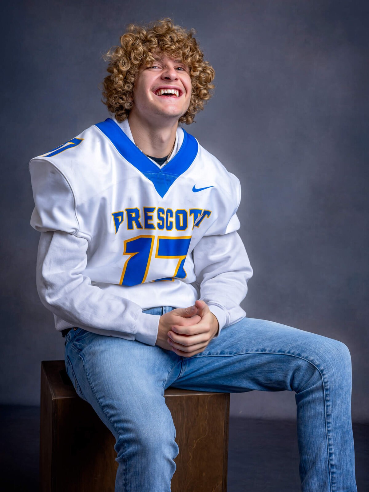 Prescott High School football player laughs in photos with Prescott senior photographer Melissa Byrne
