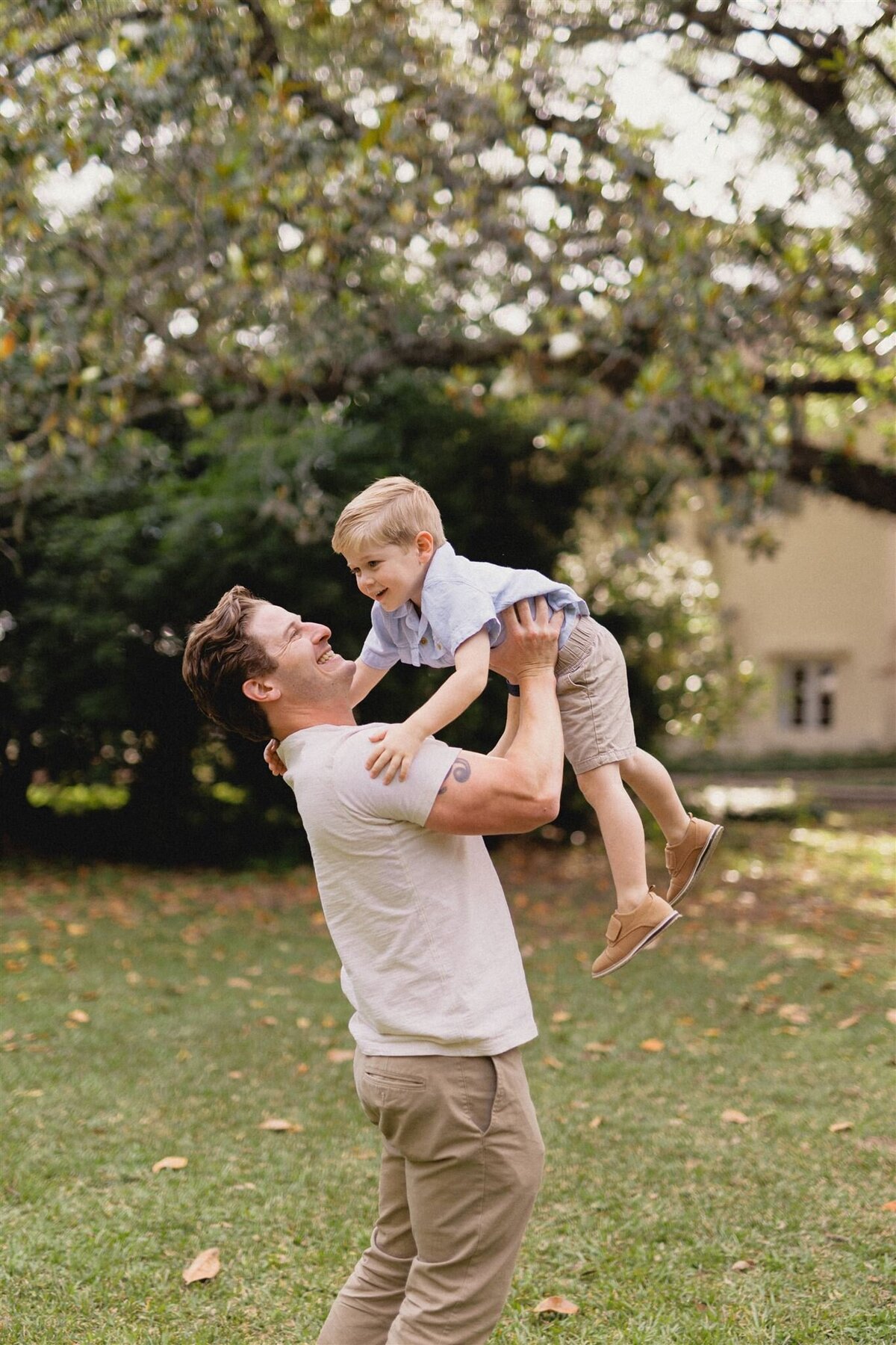 dad-lifting-son