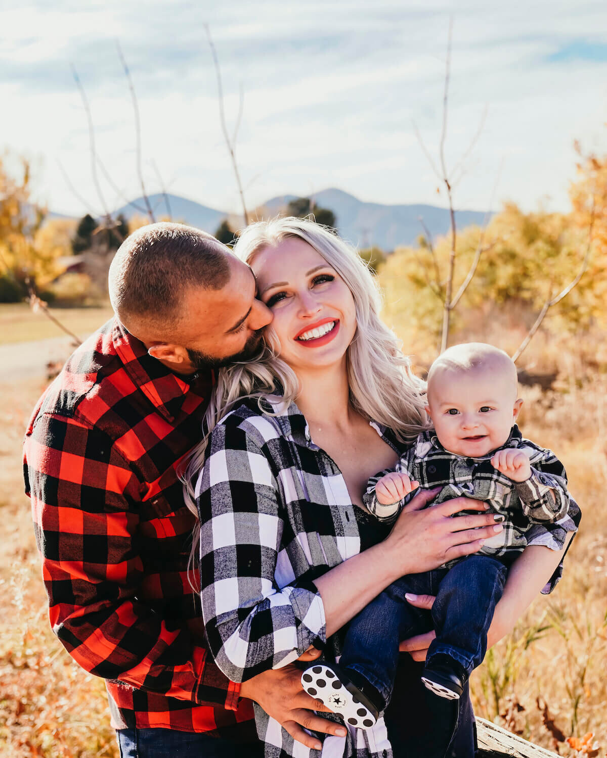 denver co family photographer - couple holding smiling baby