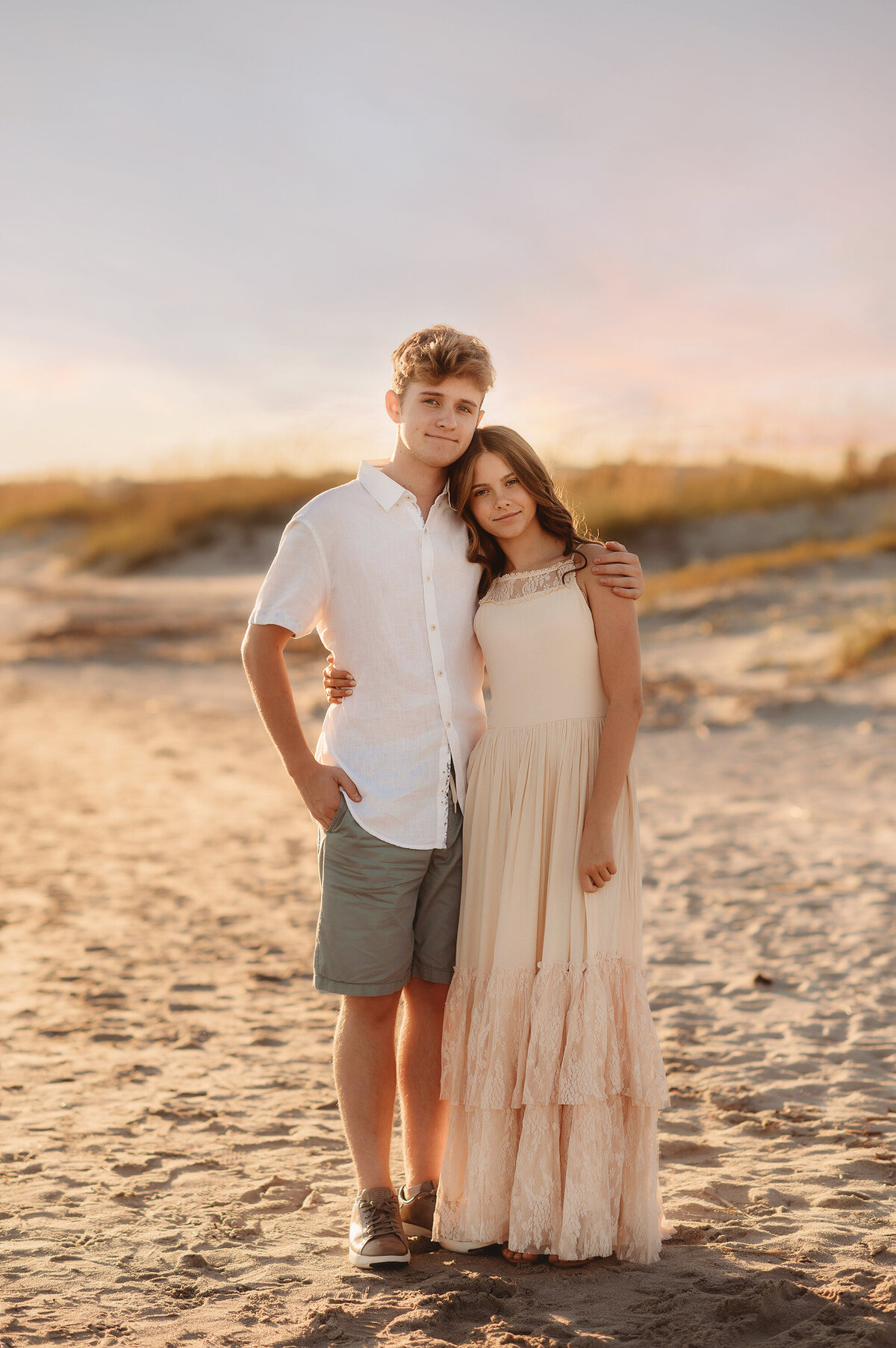 Siblings embrace during Family Photos on Isle of Palms.