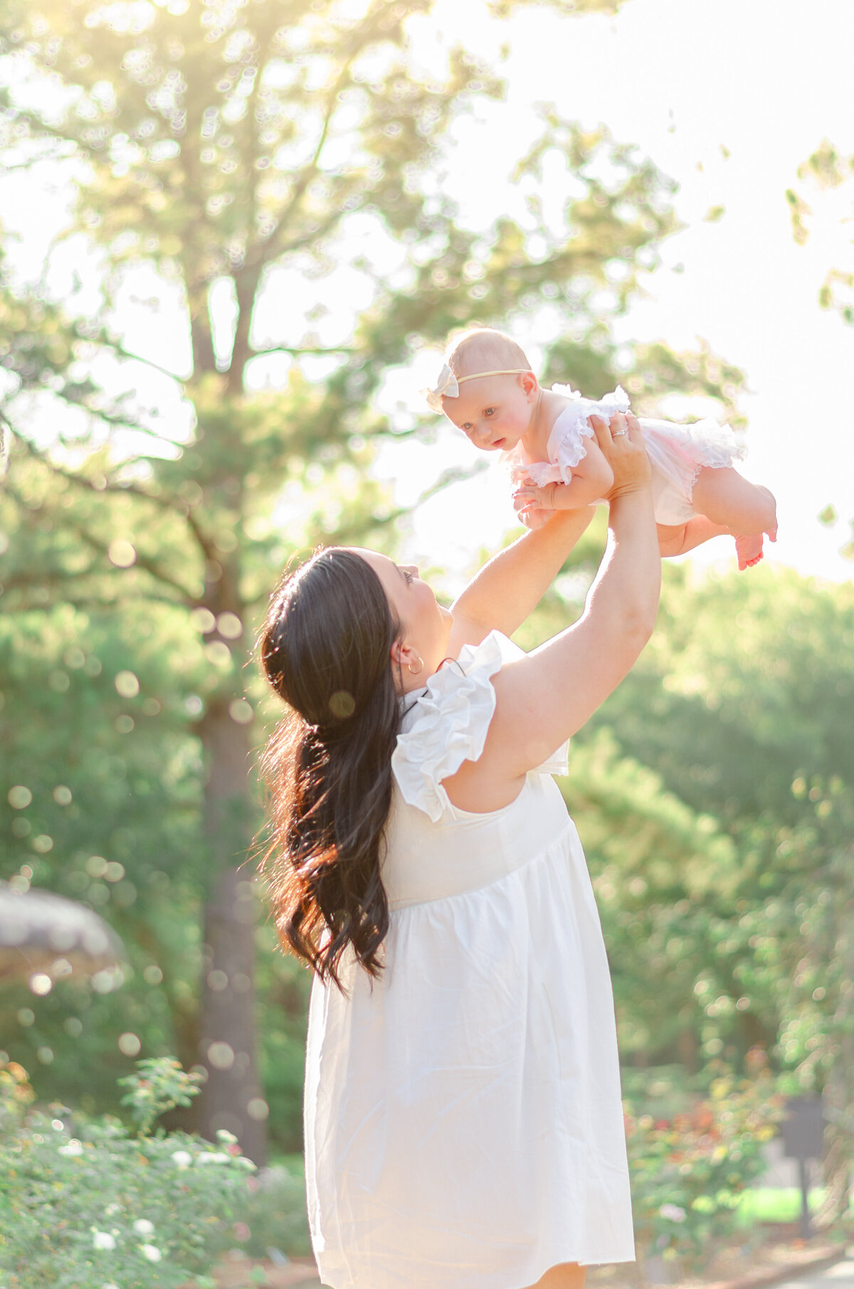 mom throws her baby in the air