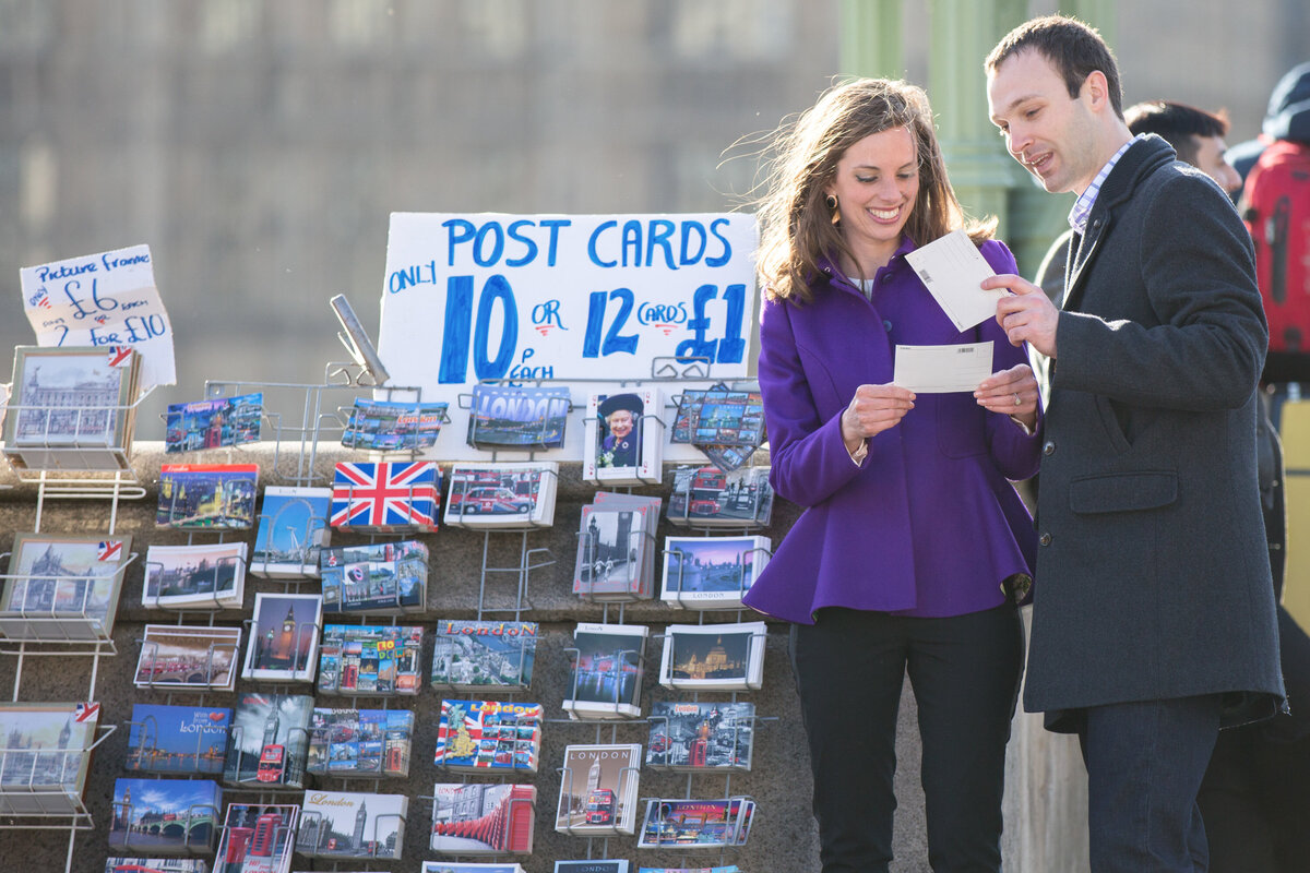 Couple looking at postcards together