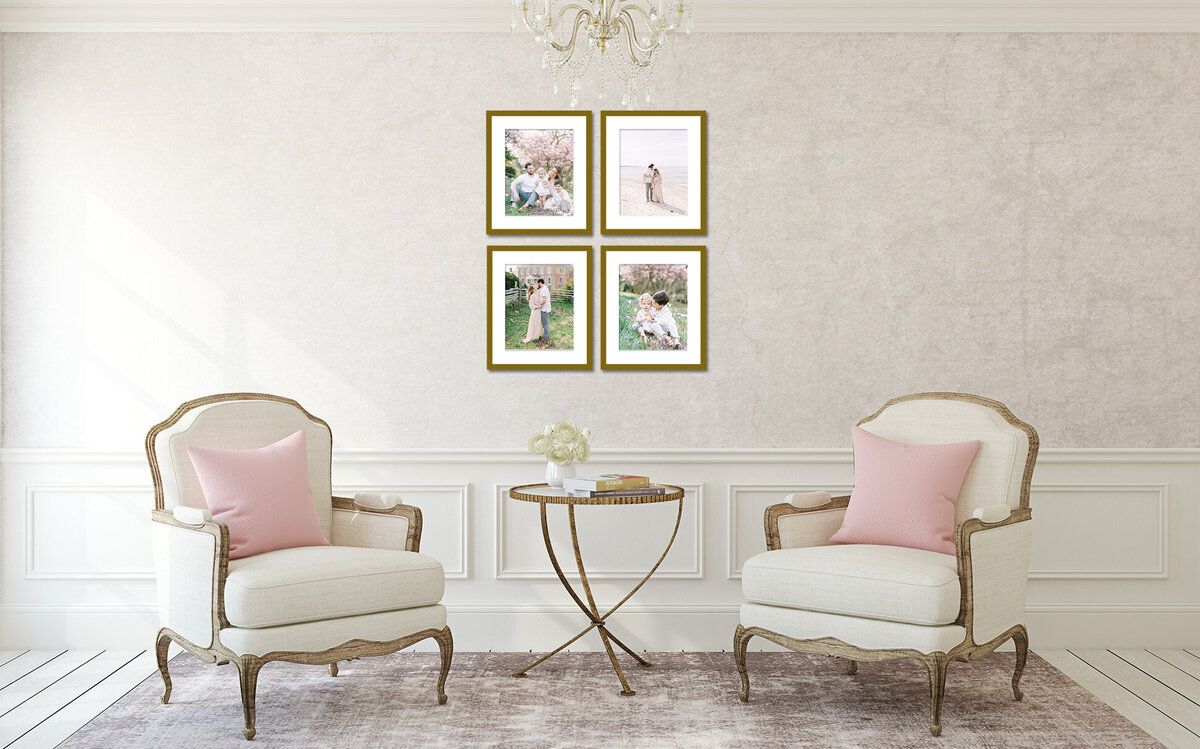 A living room with two chairs and pink pillows with four family photos hanging on the wall