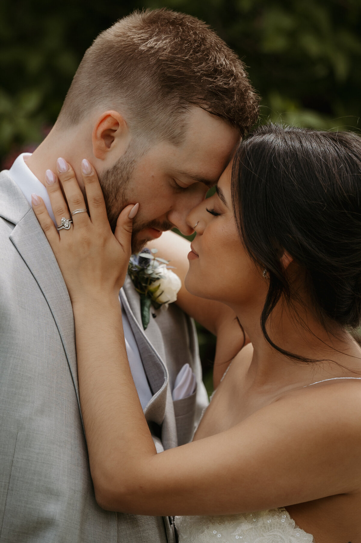 couple embracing at edmonton wedding during bride and groom portraits