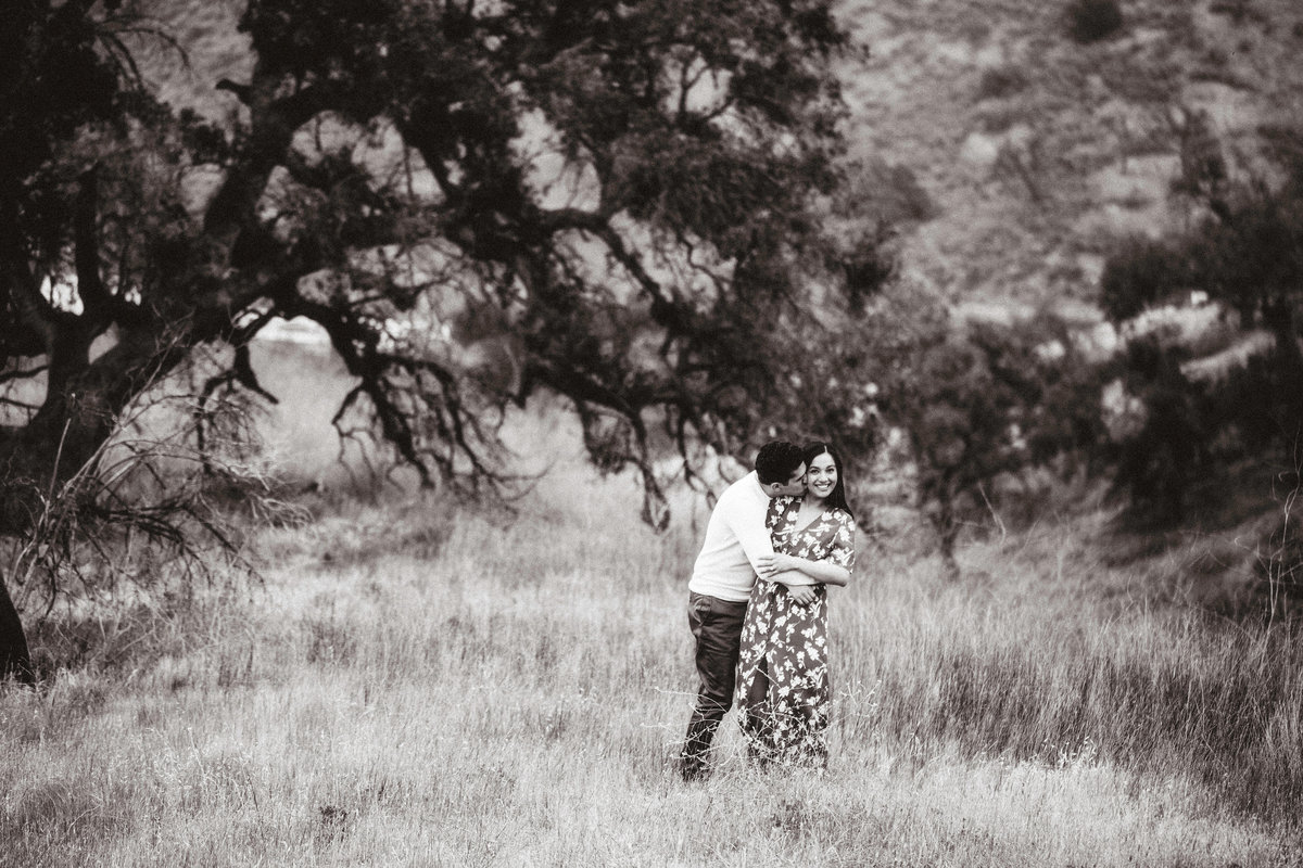 Engagement Photograph Of  Man Kissing a Woman From The Back Black And White Los Angeles
