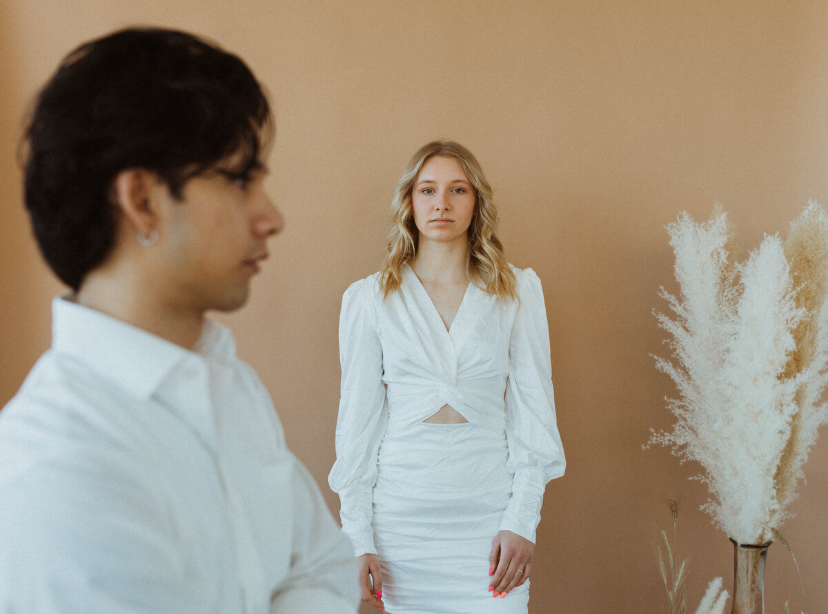 A private studio elopement located in  St. Cloud, Minnesota. Tahlia and Lito enjoy intimate moments reading vows, getting creative, and focusing solely on each other.