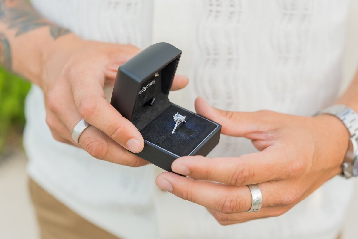 Close-up of engagement ring on Big Island beach