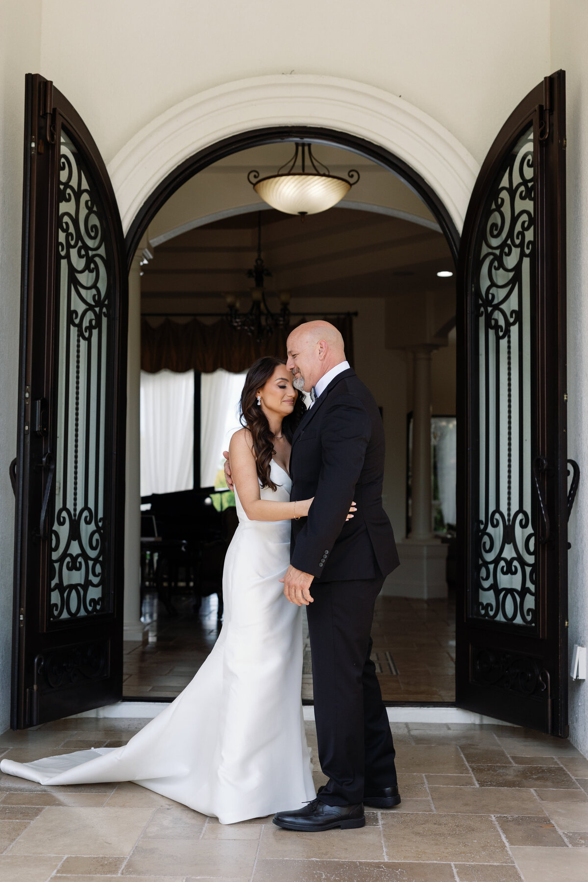 Emotional first look moment between bride and father at La Casa Toscana