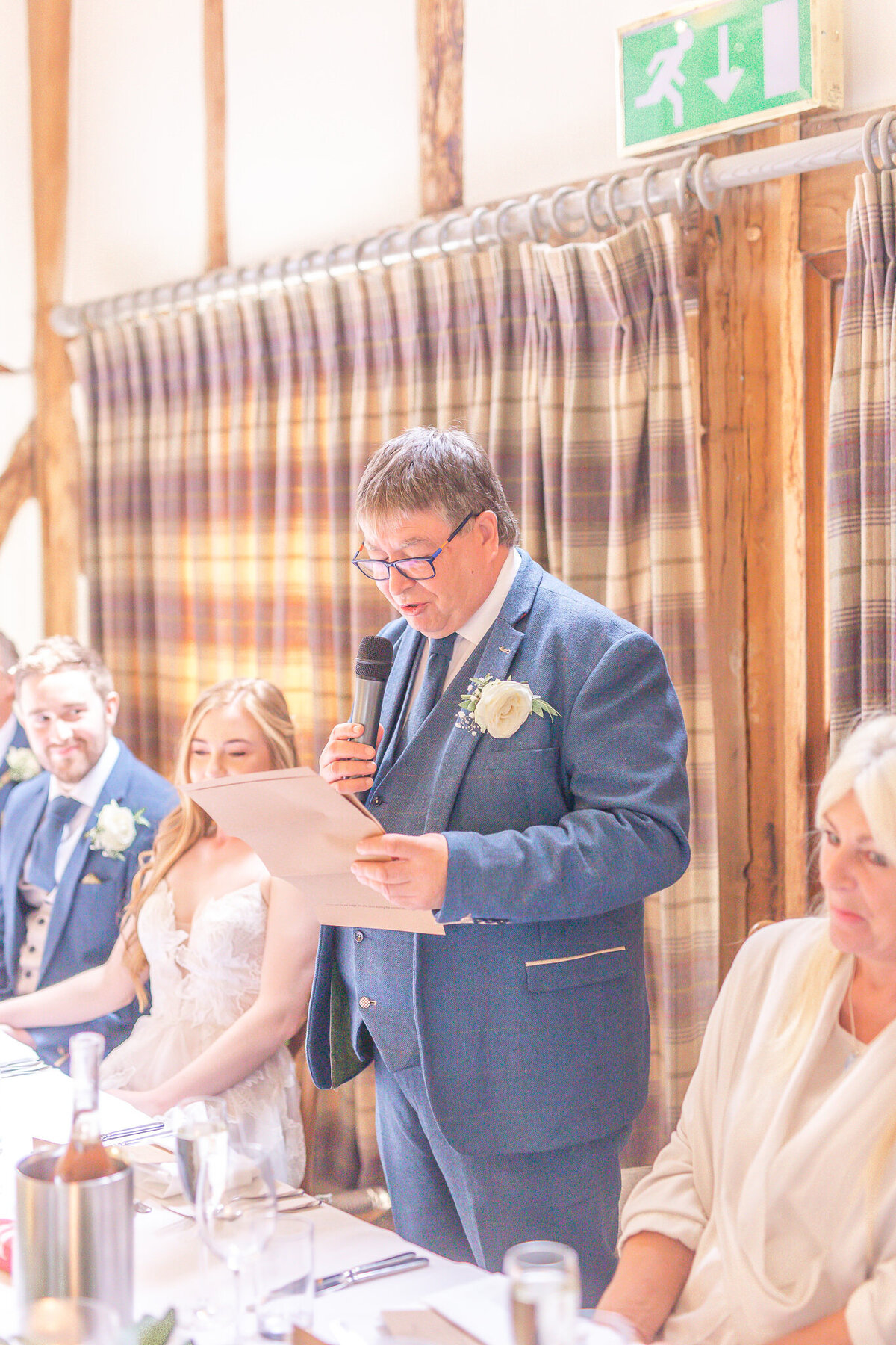 Father of the bride standing giving a speech