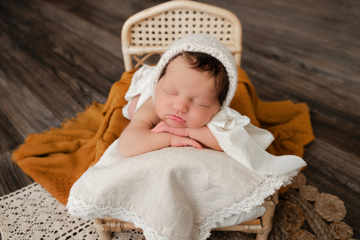 Photos by Ashleigh offers professional studio newborn photography services in Oklahoma City. Capturing precious moments of your little one with expertise and care. Book your session today!