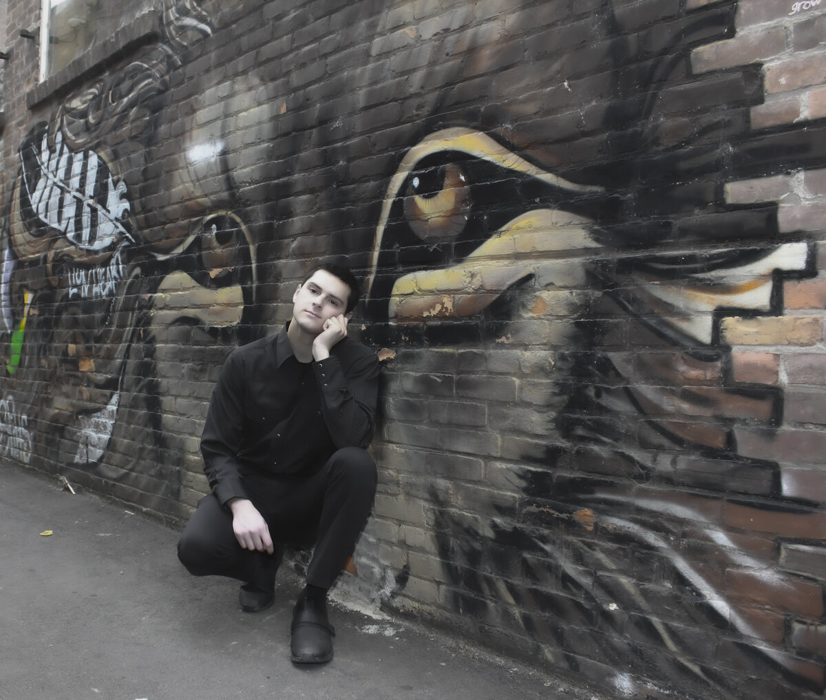 Senior Portrait with wolf graffiti wall