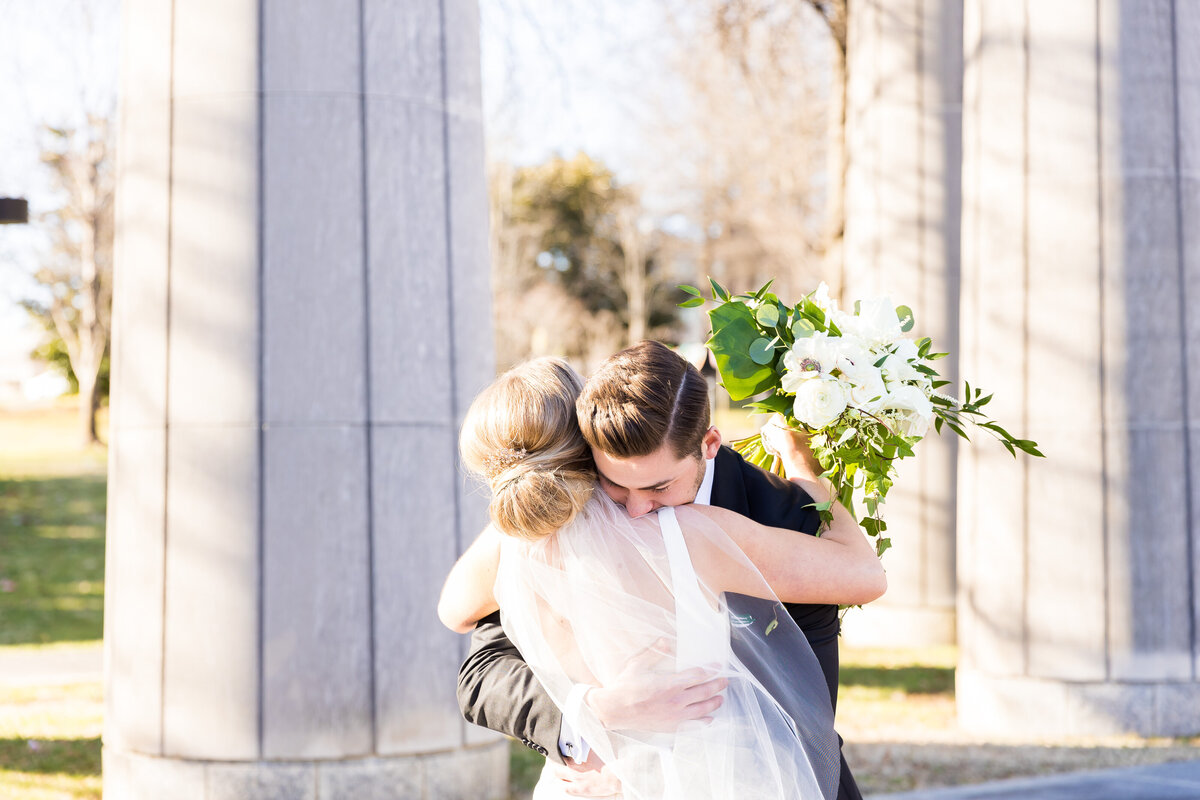 Bride and groom hugging at wedding at  Tennessee State Museum