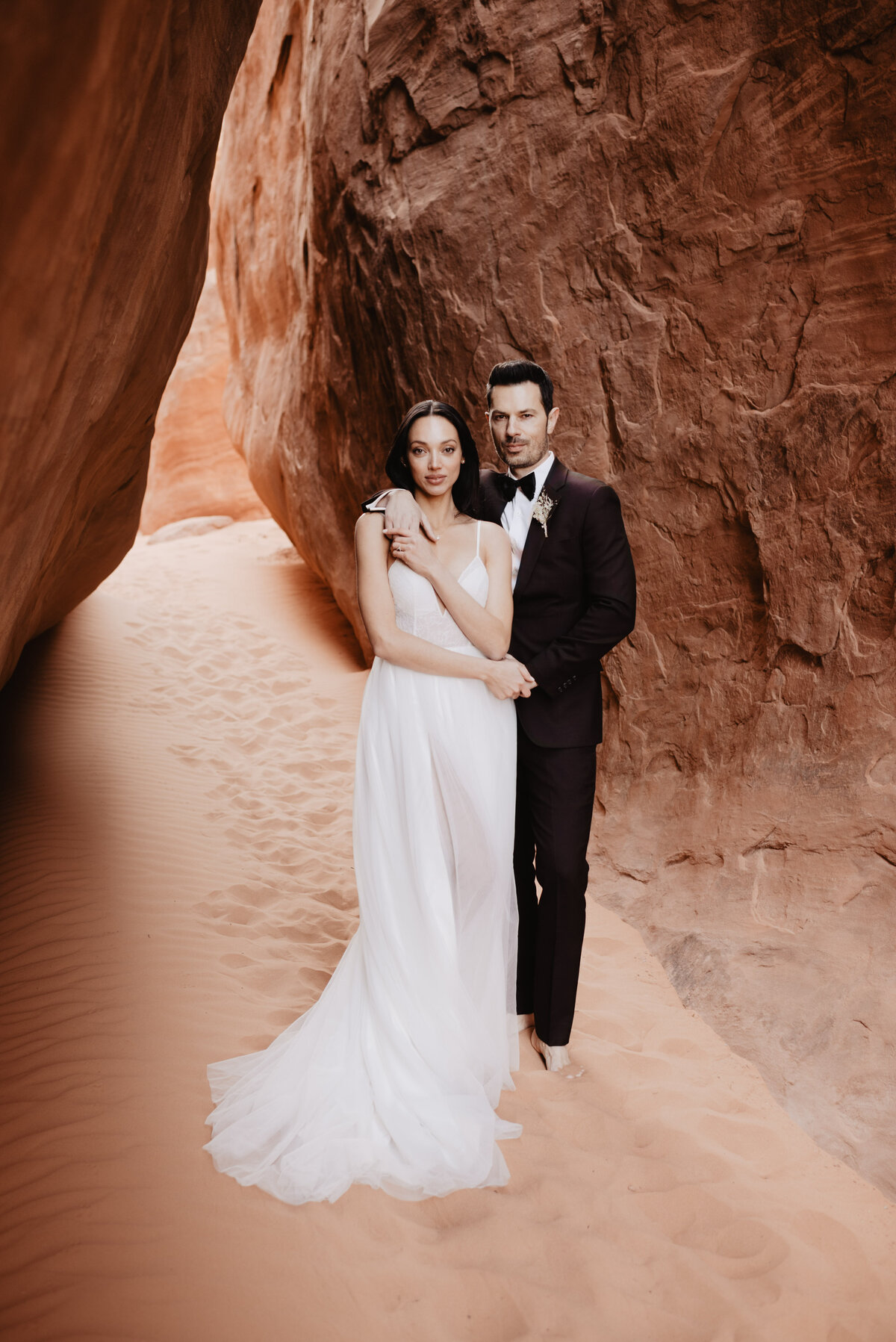 Utah elopement photographer captures bride and groom holding hands