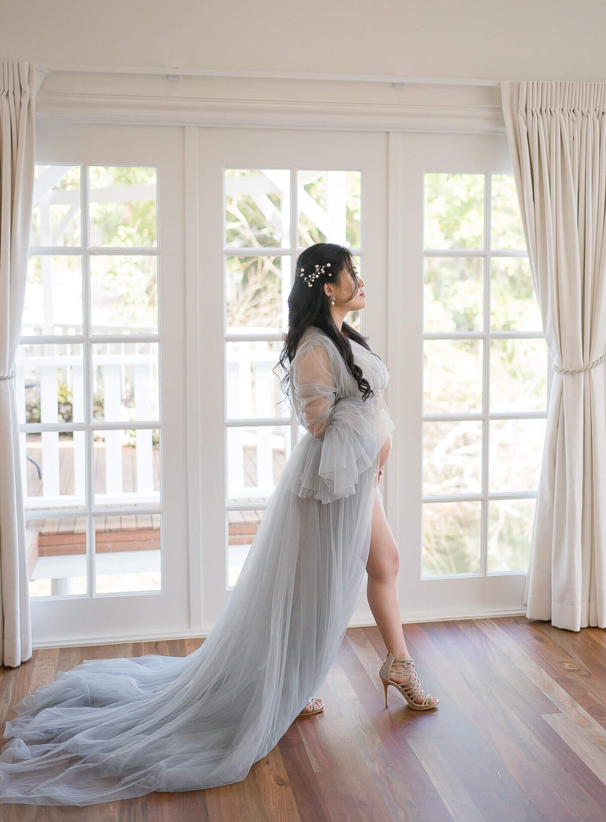 Celebrate impending motherhood as a mum dons a beautiful blue tulle gown, capturing maternity bliss at Gold Coast's Kwila Lodge