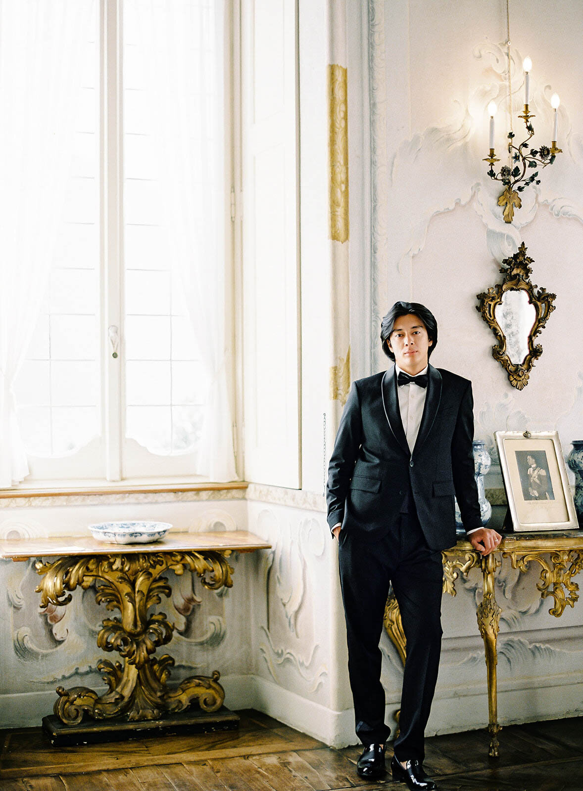 Film photograph of groom in tuxedo inside Villa Sola Cabiati on his wedding day on Lake Como in Italy photographed by Lake Como wedding photographer