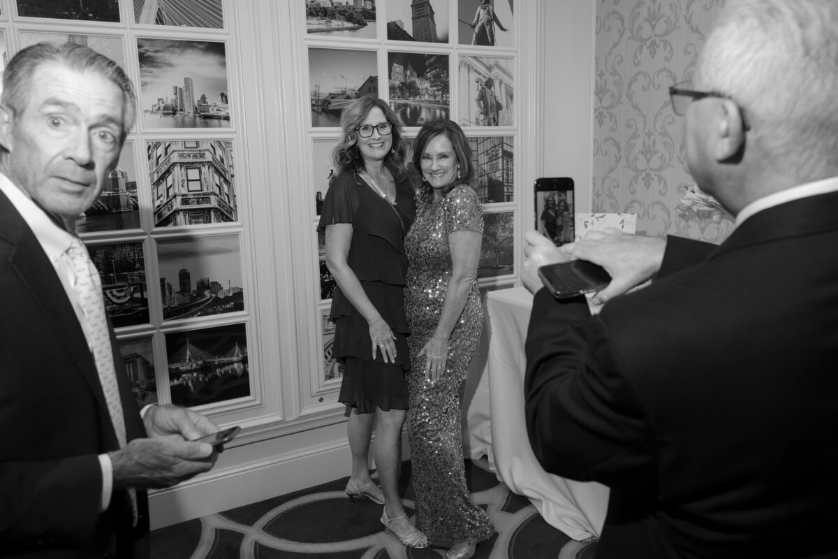 wedding-guests-taking-photo-street-photograph