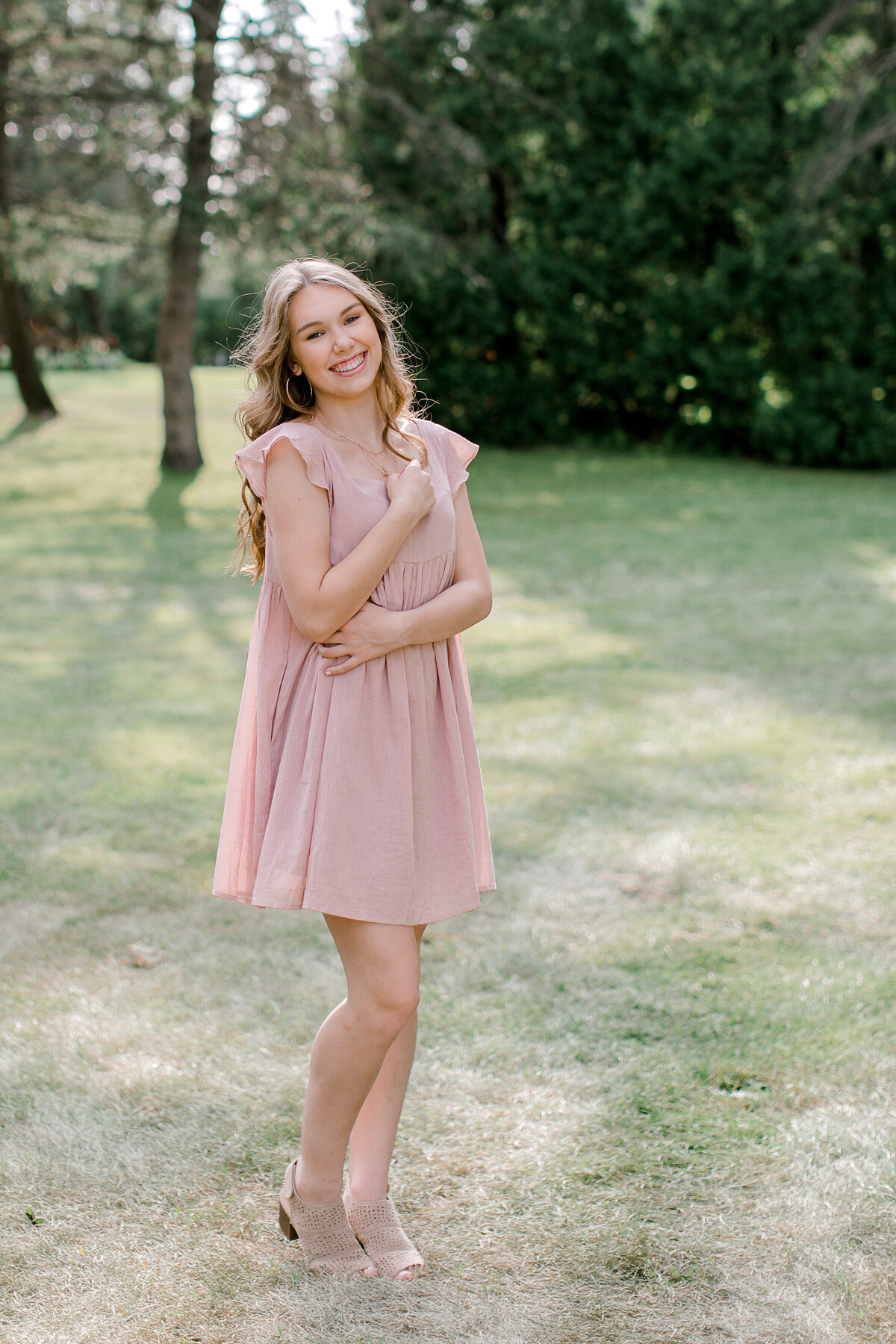 Forest Lake high school senior smiling in pink dress