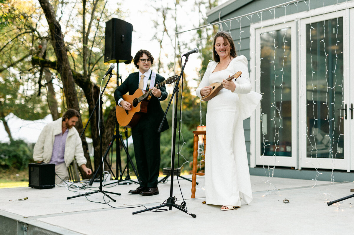 Bride and groom performing on stage at their wedding