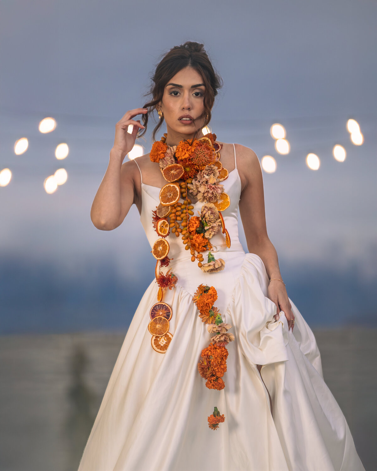 Salt Lake City bridal photographer capturing a modern bride wearing a dried orange and marigold floral garland. Moonlit Photo Utah wedding photography focused on editorial bridal fashion and artistic wedding portraits.
