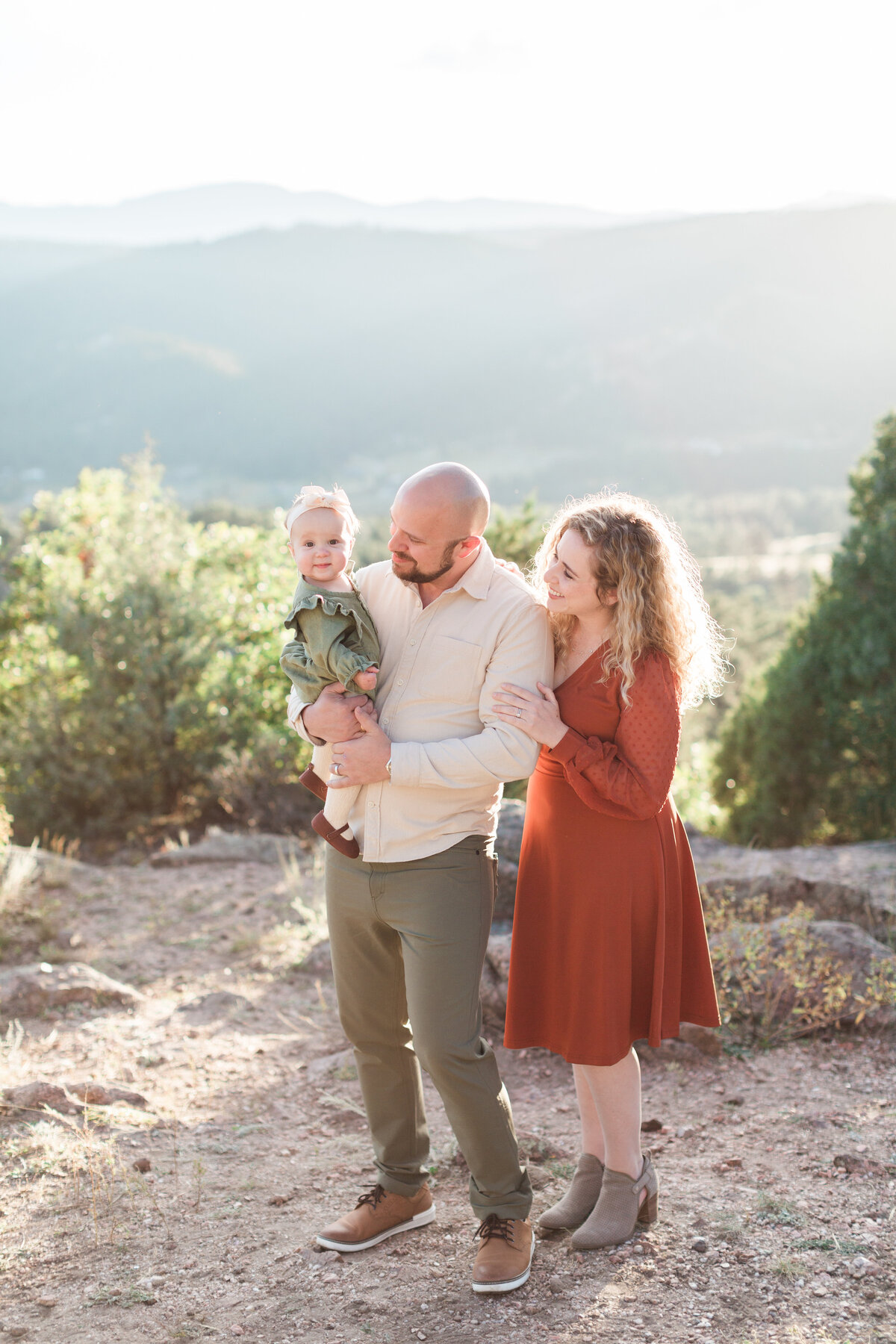 A family with their baby in the mountains during their mini session