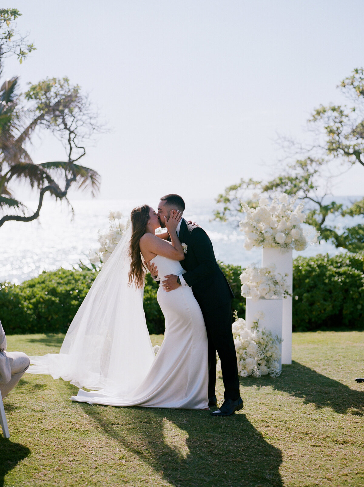 Romantic first kiss down the aisle, captured in a candid wedding photography style — Carmel wedding photography by Kate Winters Photography.