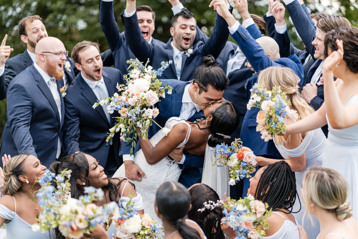 bridal party cheering on couple at sycamore farms wedding