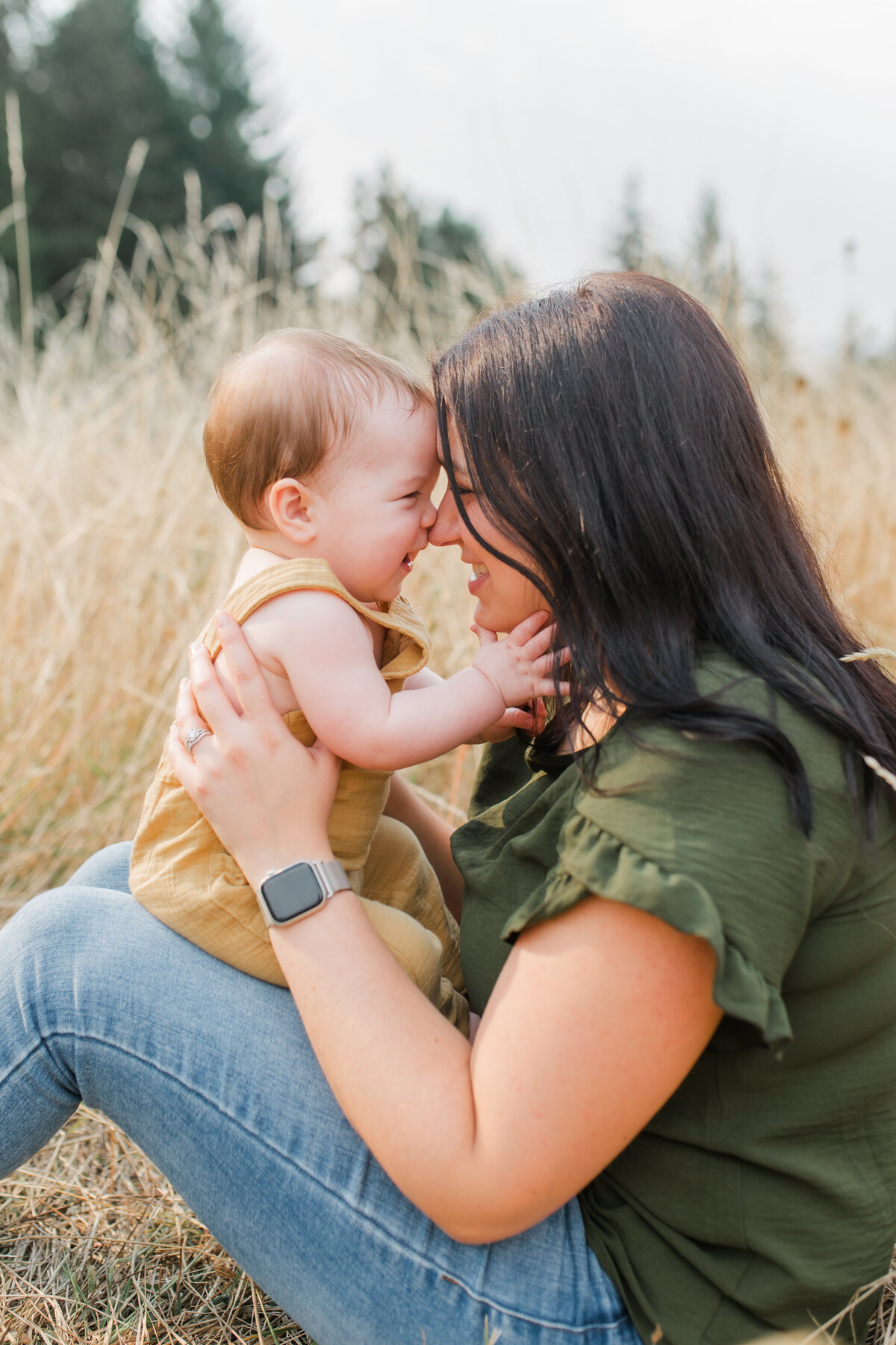 Mother and daughter on the field joyfully facing each other