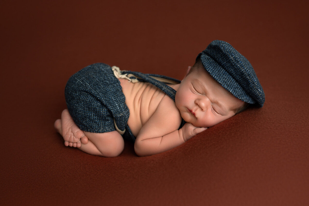 Newborn baby boy navy hat brown backdrop Spanish Oaks photographer