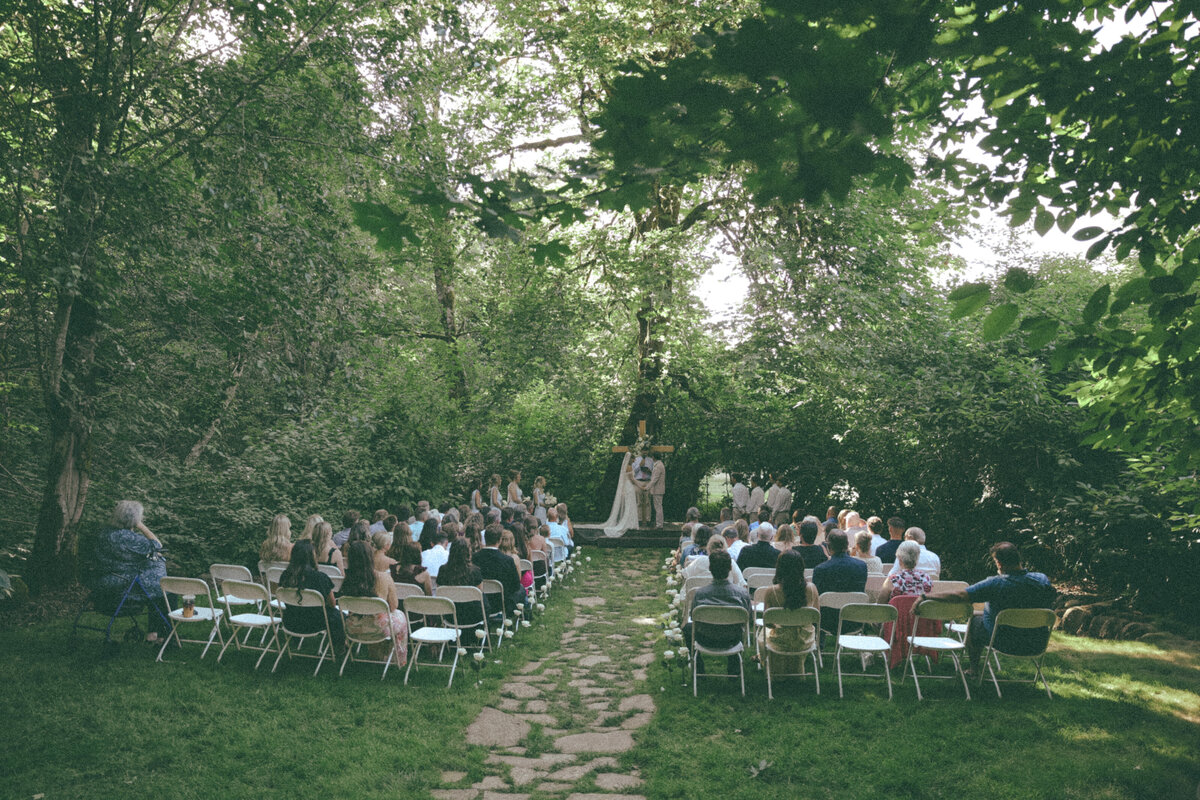 Outdoor Forest Ceremony Surrounded by Guests | Romantic Pacific Northwest Wedding Photography