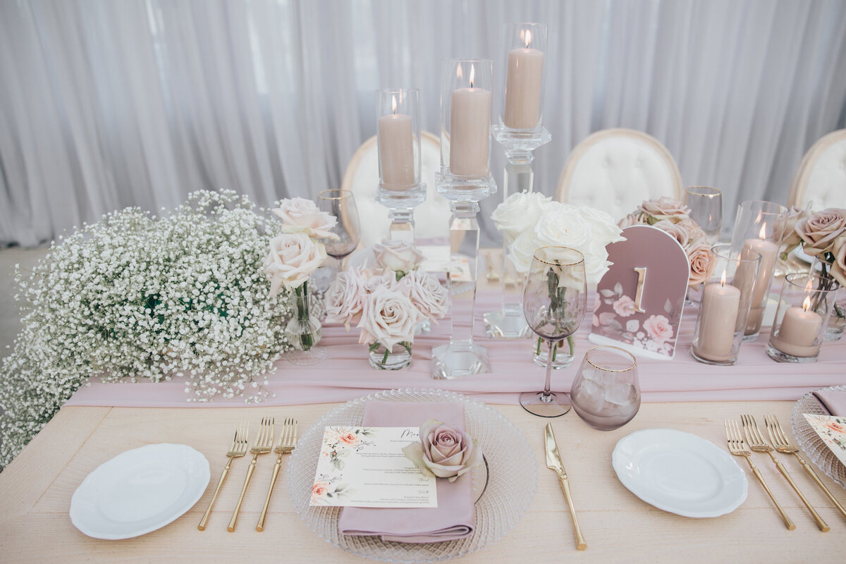 Chic lavender and ivory head wedding table decor with baby's breath florals