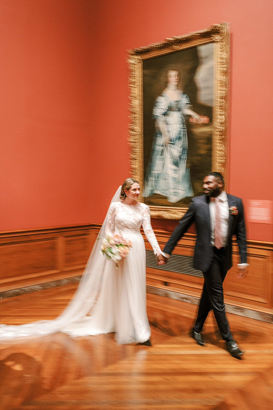 bride and groom in orange room at art museum